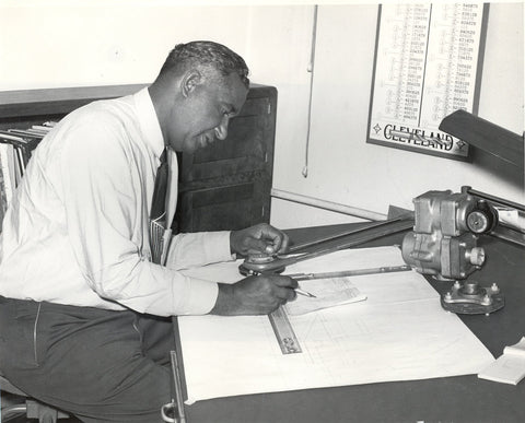 Frederick McKinley Jones working at a drafting table.