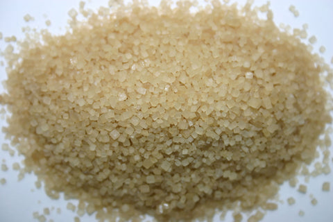 Close-up of raw Demerara cane sugar crystals.